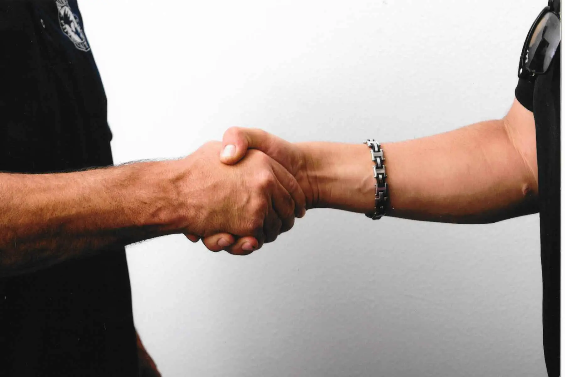 Trainer shaking hands with man